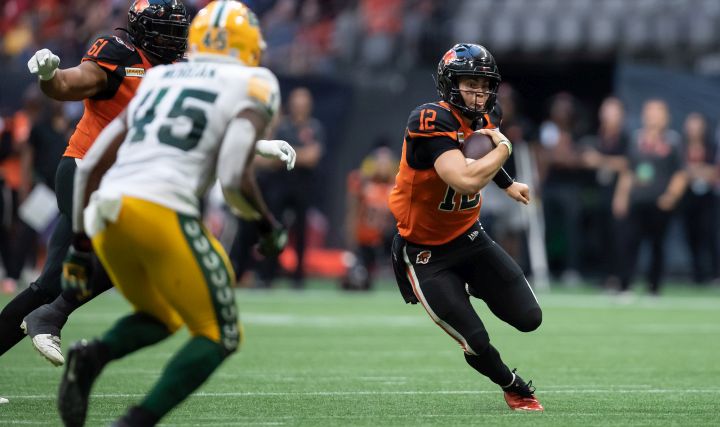 B.C. Lions quarterback Nathan Rourke (12) runs with the ball during the first half of CFL football game against the Edmonton Elks in Vancouver, on Saturday, August 6, 2022.