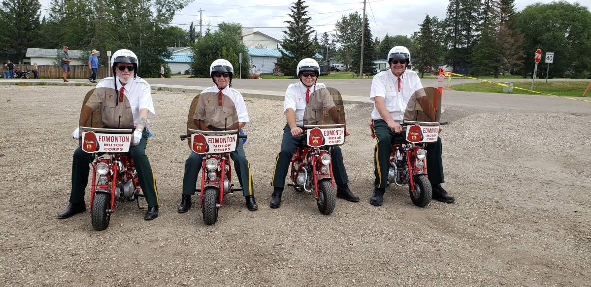 Members of the Al Shamal Shrine Motor Corps. on the 1967 Honda Z50 monkey bikes at an event in Alberta.