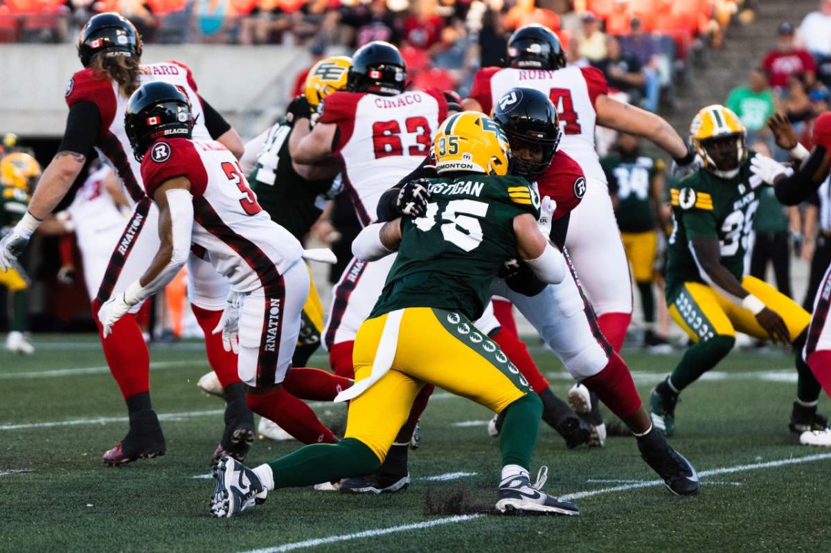 Elks defensive Thomas Costigan rushes the passer