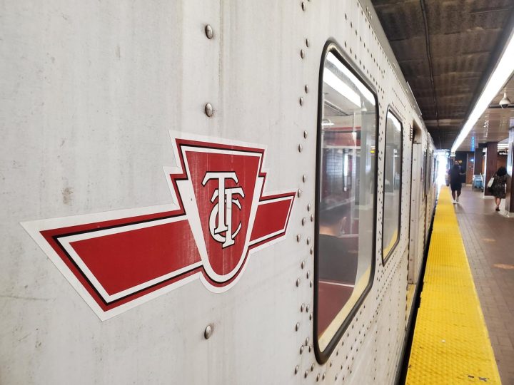 The TTC logo is seen on the side of a subway car at Kipling Station on Aug. 5, 2022.