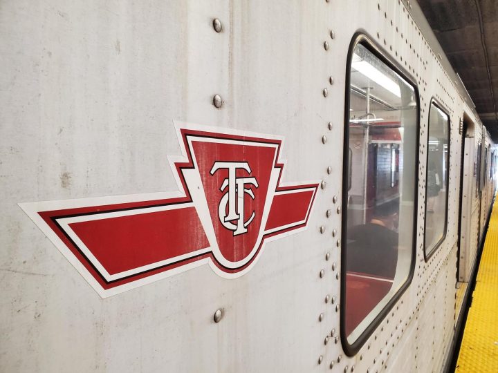 The TTC logo is seen on the side of a subway car at Kipling Station on Aug. 5, 2022.