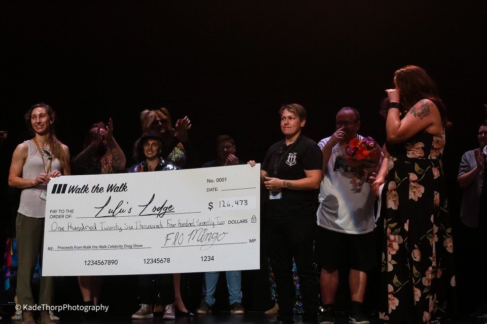 A cheque for over $126,000 is presented to Lulu's Lodge following the Walk the Walk celebrity drag show in Regina on August 27. 