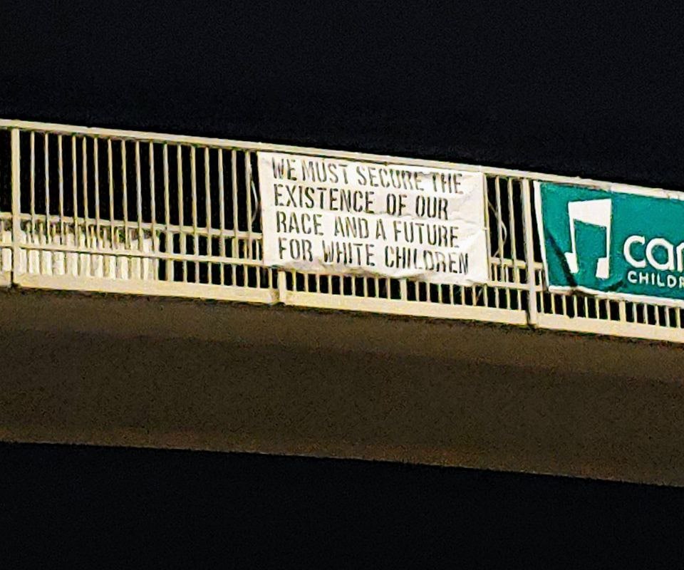 A banner containing white supremacist David Lane's "14 words" is shown on a pedestrian overpass over Calgary's Macleod Trail, from a photo posted on social media on August 8, 2022.