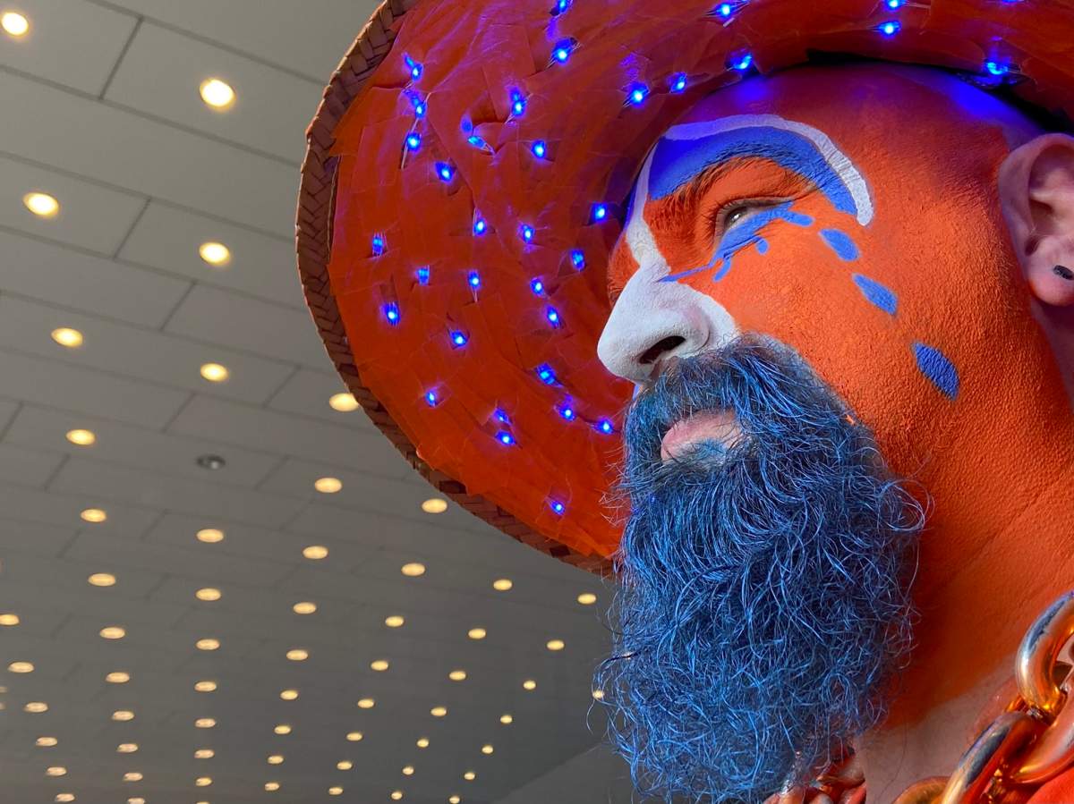 People gather outside Rogers Place Friday, Aug. 19, 2022 as a procession to say farewell to six-year-old Oilers fan Ben Stelter passes by.