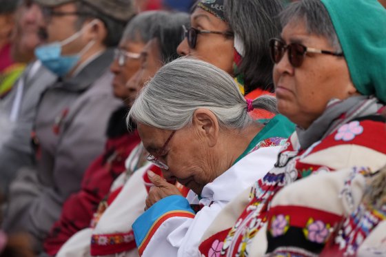 An Indigenous elder cries during a visit from Pope Francis.