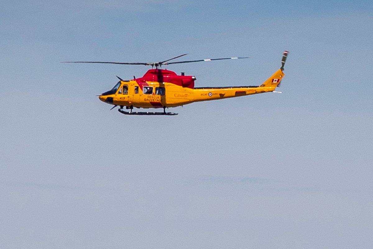 FILE - A CH-146 Griffon Search and Rescue helicopter (SAR) flies past CFB Trenton in Trenton, Ontario on Monday, June 20, 2022. 
