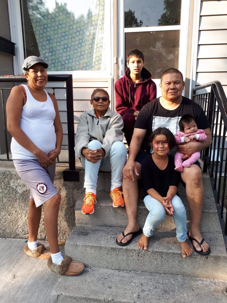 Chris Amyotte with his partner Amanda, his mother and two of his children. 