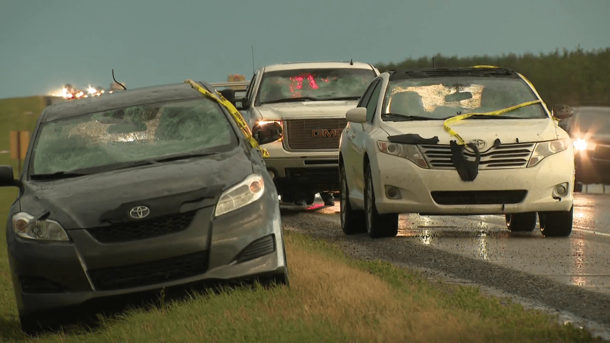 Severe Alberta weather leaves cars damaged, lined up along the highway