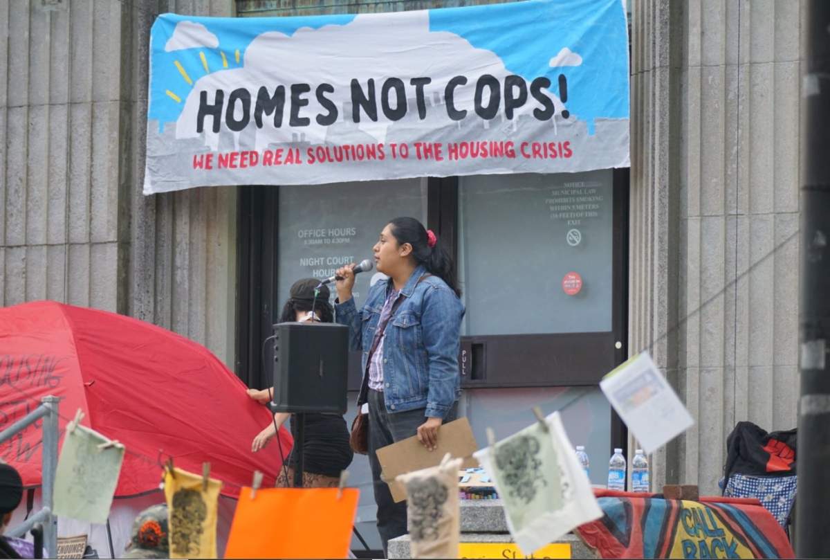 Stacy Gomez from group No One Is Illegal speaks at the housing rally at the Old Library in Halifax.