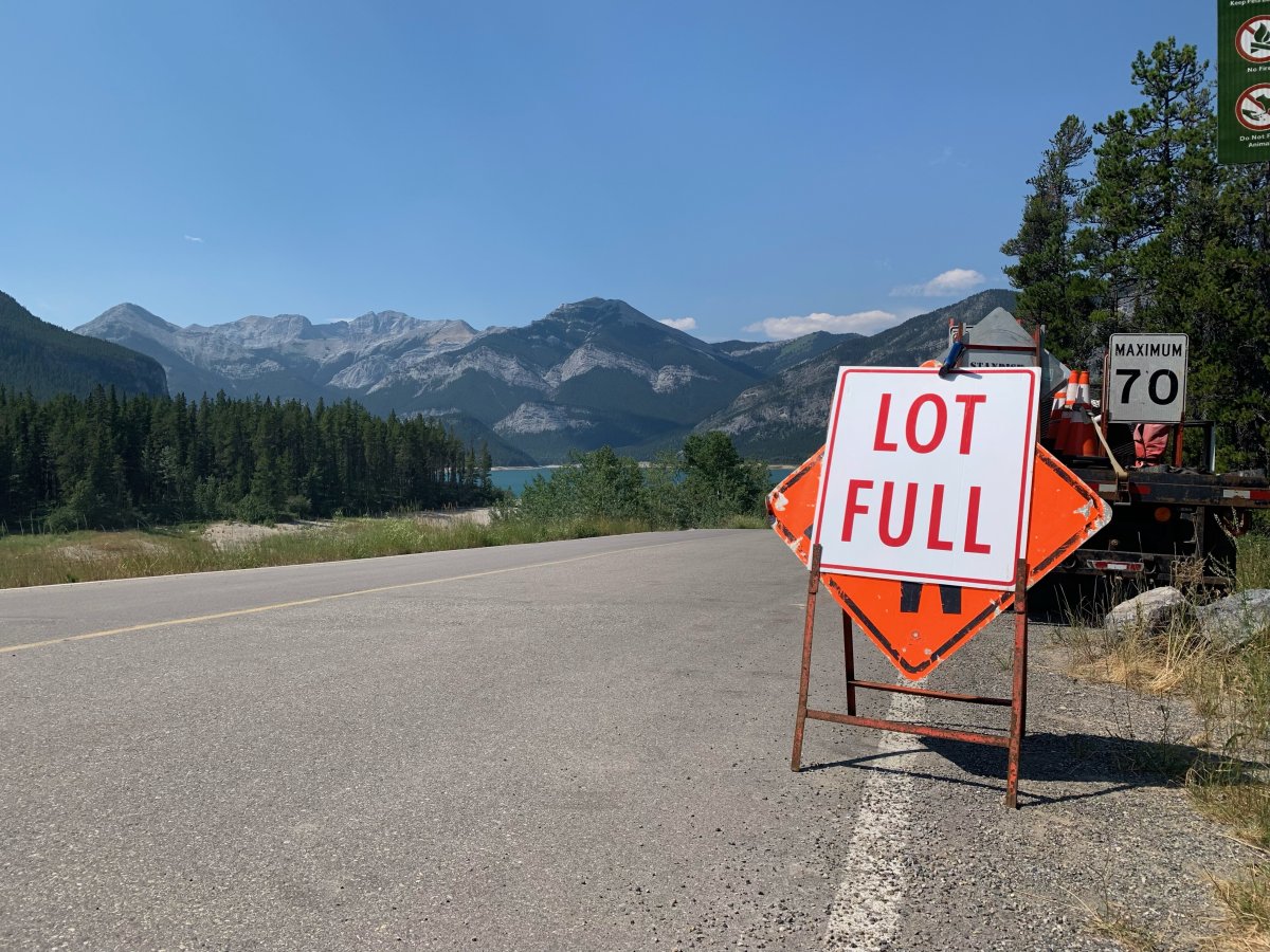 Visitors arriving to a Barrier Lake parking area late Monday morning were met by "lot full" signs. 