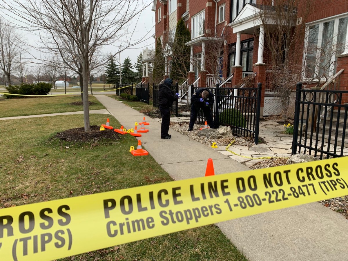 Halton Regional Police officers on scene investigating a residential shooting in the Greenery area of Oakville on Sunday March 21, 2021.