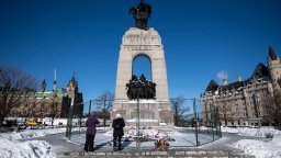 Fencing surrounds the War Memorial in Ottawa after it was disturbed by protesters.