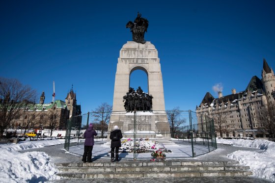 Fencing surrounds the War Memorial in Ottawa after it was disturbed by protesters.