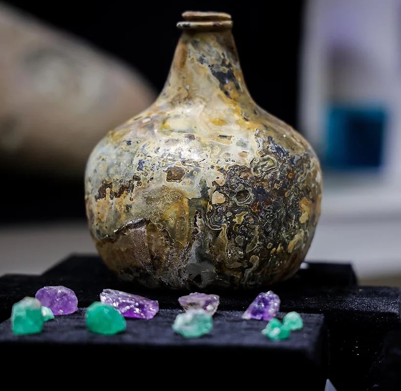 An olive jar and rough-cut emeralds and amethysts that were mined in Colombia were found on the wreck of the Maravillas.