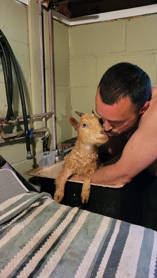 Jason Oliver with his goat, Gilly