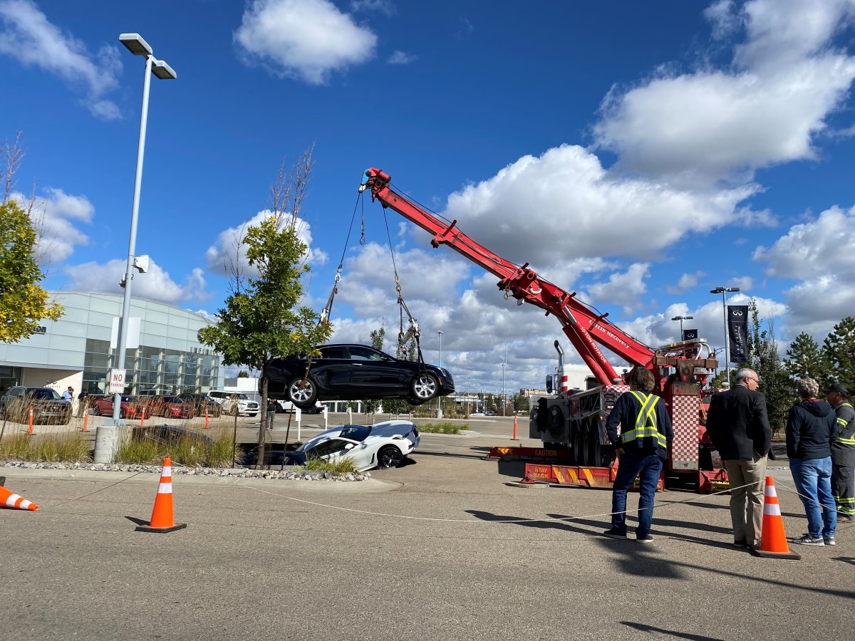 Sinkhole swallows several cars at south Edmonton dealership Edmonton