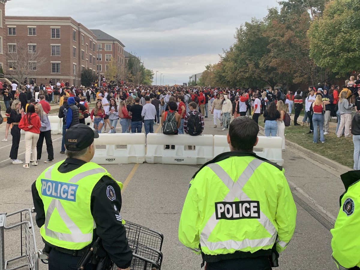In a file photo, Guelph police officers looked on as students gathered for the annual school homecoming.