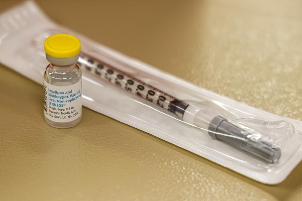 FILE - A vial containing the monkeypox vaccine and a syringe is set on the table at a vaccination clinic run by the Mecklenburg County Public Health Department in Charlotte, N.C., Saturday, Aug. 20, 2022. In the wake of a study released on Thursday, Sept. 8, 2022, U.S. officials are considering broadening recommendations for who gets vaccinated against monkeypox, possibly to include many men being treated for HIV or those who recently had other sexually transmitted infections. (AP Photo/Nell Redmond, File).