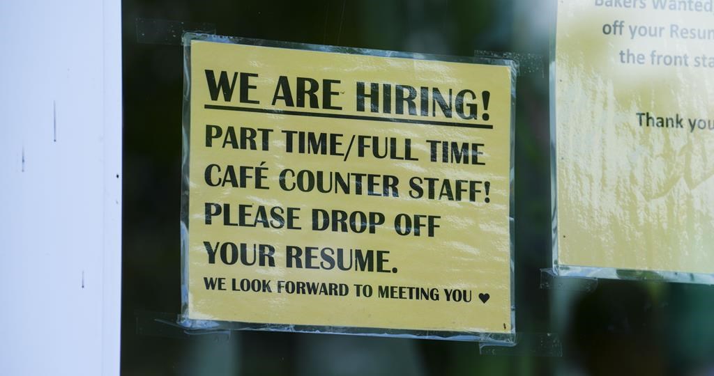 A sign for help wanted is pictured in a business window in Ottawa on Tuesday, July 12, 2022.