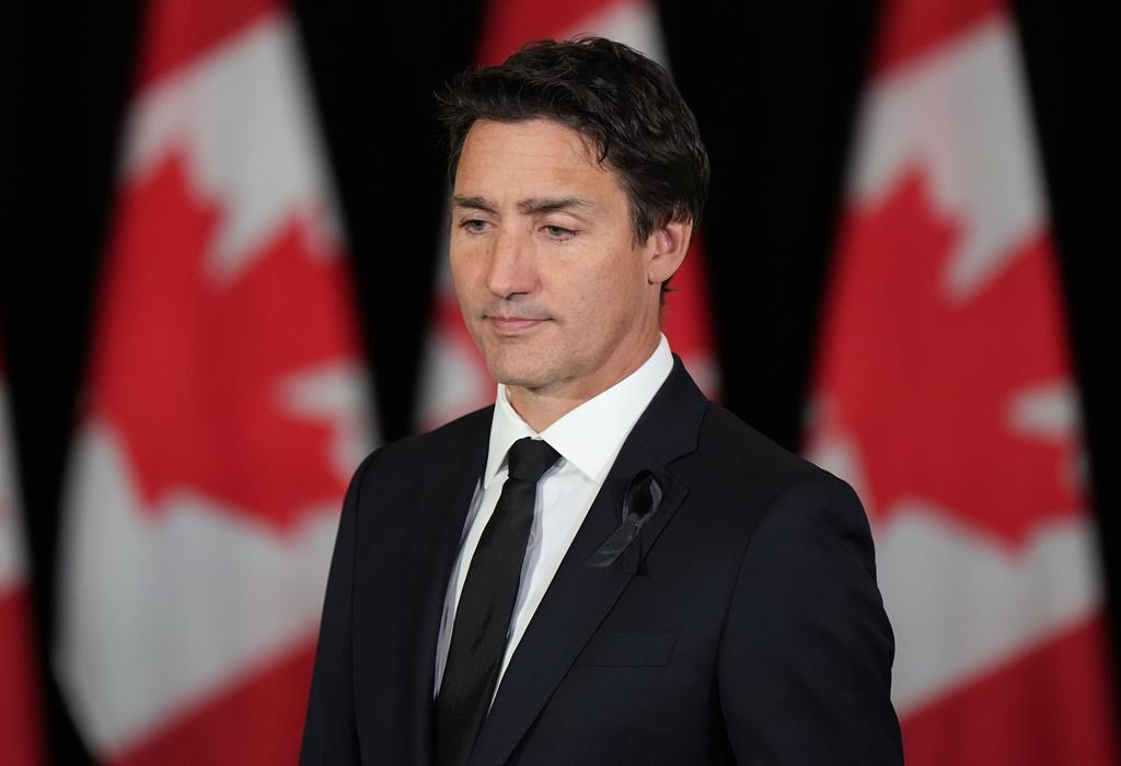 Prime Minister Justin Trudeau wears a black ribbon on his lapel as he arrives to deliver a statement on the passing of Queen Elizabeth II in Vancouver on Thursday, September 8, 2022. Prime Minister Justin Trudeau and British Columbia Premier John Horgan met over lunch in Vancouver on Friday, before Trudeau was set to travel back to Ottawa following a three-day cabinet retreat marked by the death of Queen Elizabeth II.