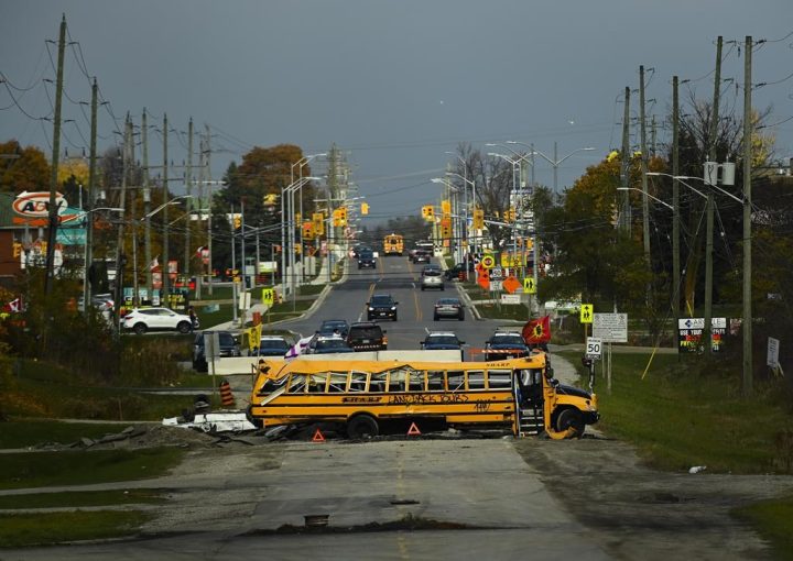 A school bus blocks the roadway which is near a construction site at the centre of an Indigenous land dispute in Caledonia, Ont., on Thursday, October 29, 2020. The legal saga around the two-year occupation of a proposed development site by a group of Indigenous people continued in Ontario court on Monday.