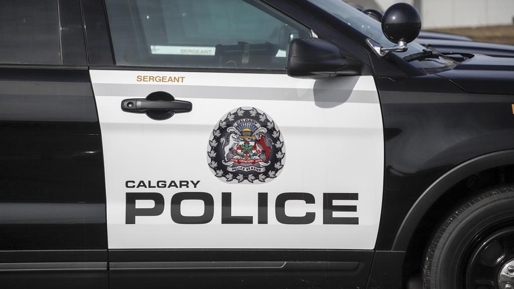 Police vehicles are seen at Calgary Police Service headquarters on April 9, 2020.