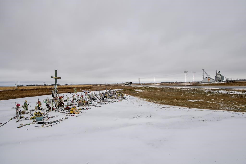 A memorial for the fatal bus crash involving the Humboldt Broncos hockey team at the intersection of Highways 35 and 335 near Tisdale, Tuesday, Oct. 27, 2020. The Saskatchewan Court of Appeal has set aside a temporary injunction preventing a lawsuit filed by a some of the parents of those who died in the crash from going ahead.