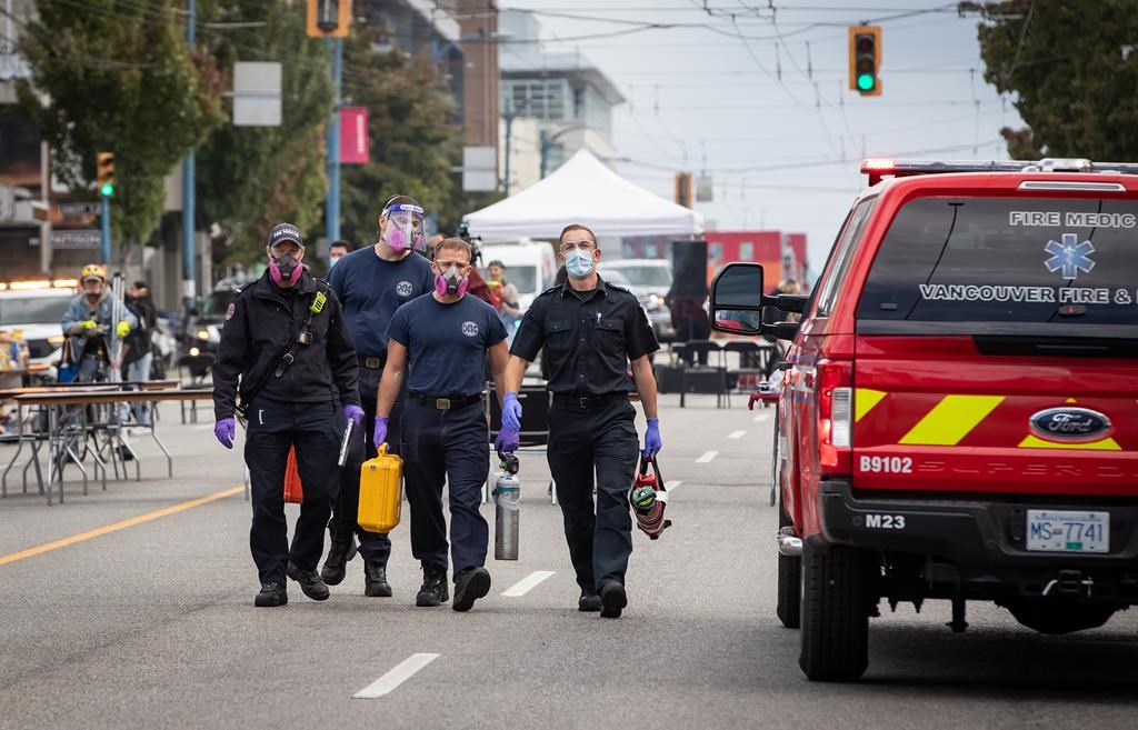 Firefighters and paramedics leave after responding to a call where they could not locate a patient in the Downtown Eastside of Vancouver, on International Overdose Awareness Day on Tuesday, August 31, 2021. The coroners service in British Columbia says nearly 1,500 people have died this year from illicit drug use in the province. THE CANADIAN PRESS/Darryl Dyck.