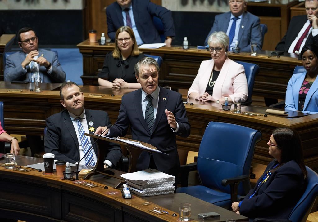 Manitoba Finance Minister Cameron Friesen delivers the 2022 budget in Winnipeg, Man., Tuesday, Apr 12, 2022 at the Manitoba Legislative Building.