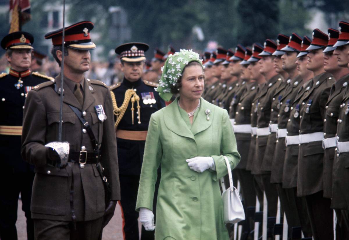 Queen Elizabeth II inspecting the guard of honour outside Cardiff City Hall, Wales, in 1977.