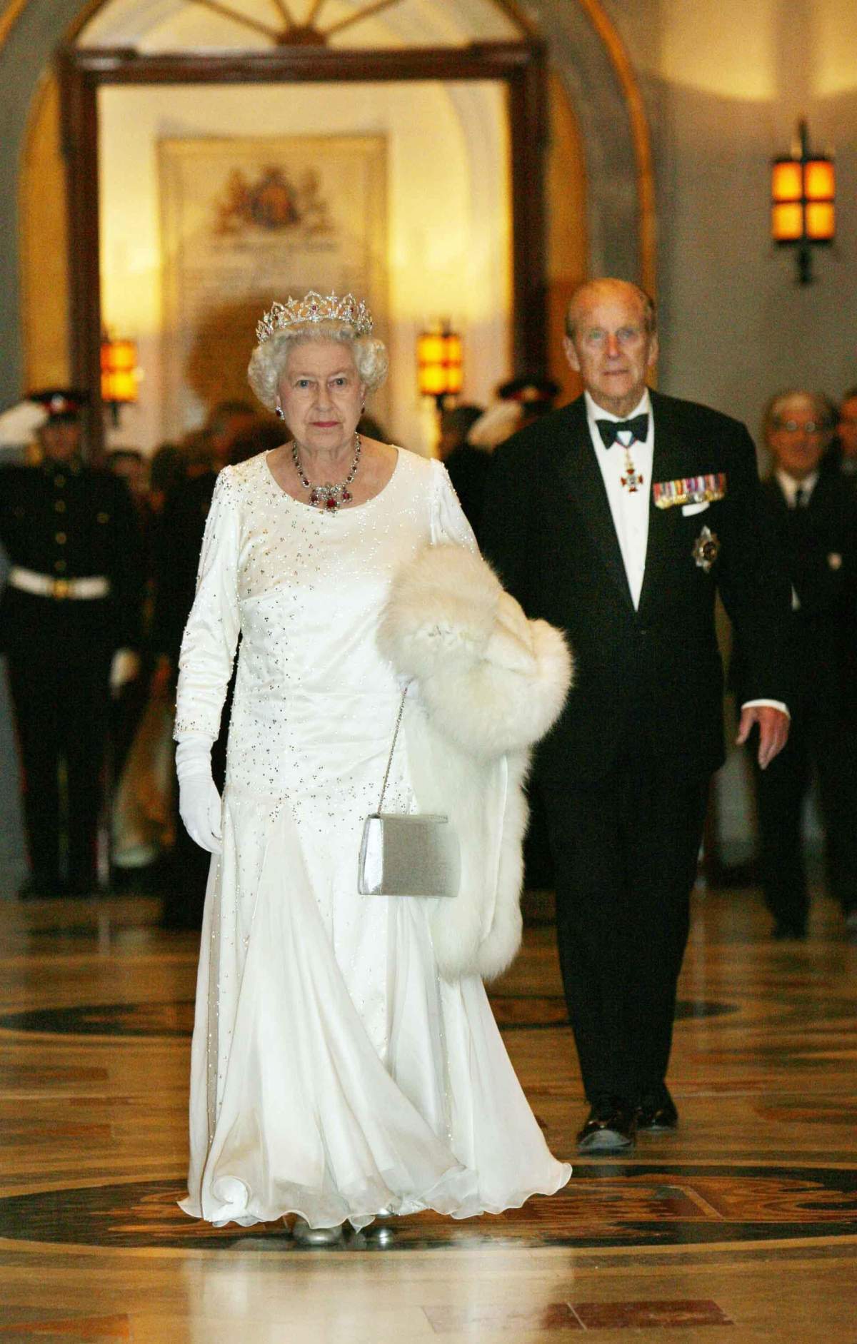 Britain's Queen Elizabeth II is accompanied by The Duke of Edinburgh while attending a State Banquet at the Palace in Malta, Nov. 23, 2005.