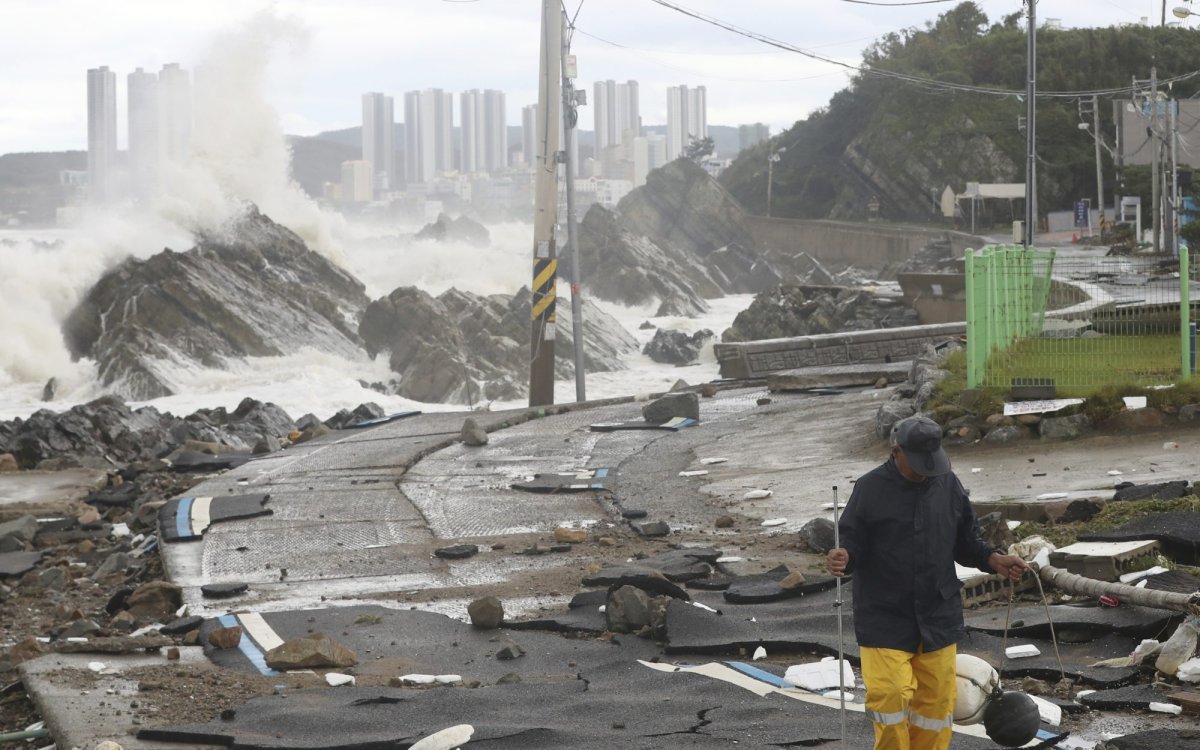 A road is damaged as waves hit a shore in Ulsan, South Korea, Tuesday, Sept. 6, 2022. The most powerful typhoon to hit South Korea in years battered its southern region Tuesday, dumping almost a meter (3 feet) of rain, destroying roads and felling power lines, leaving 20,000 homes without electricity as thousands of people fled to safer ground. (Kim Yong-tai/Yonhap via AP).