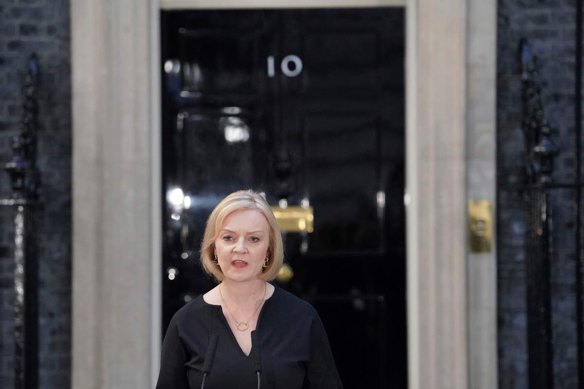 Britain’s Prime Minister Liz Truss reads a statement outside 10 Downing Street, London, Thursday Sept. 8, 2022, following the announcement of the death of Queen Elizabeth II. (Dominic Lipinski/PA via AP)