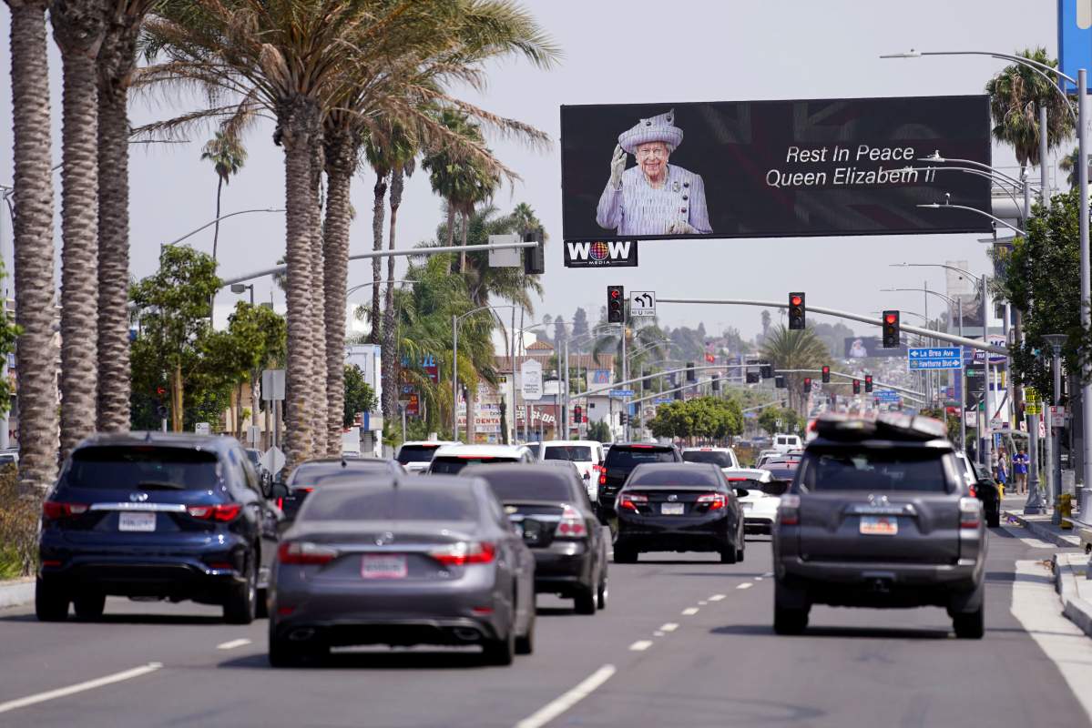 A billboard is placed in honor of Queen Elizabeth II near the Los Angeles Rams’ NFL football venue Thursday, Sept. 8, 2022, in Inglewood, Calif. (AP Photo/Mark J. Terrill)