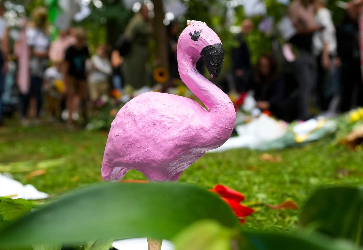 People leave different items and flowers to pay their respects near the gates of Buckingham Palace in London on Sunday, September 11, 2022. Queen Elizabeth II, Britain’s longest-reigning monarch and a rock of stability across much of a turbulent century, died Thursday Sept. 8, 2022, after 70 years on the throne. She was 96.