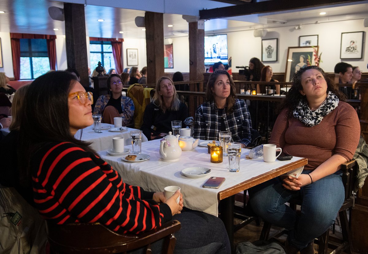 People watch the funeral of Queen Elizabeth at the Burgundy Lion pub in Montreal, Monday, Sept. 19, 2022. Queen Elizabeth, Britain’s longest-reigning monarch, died Thursday Sept. 8, 2022, after 70 years on the throne. She was 96.