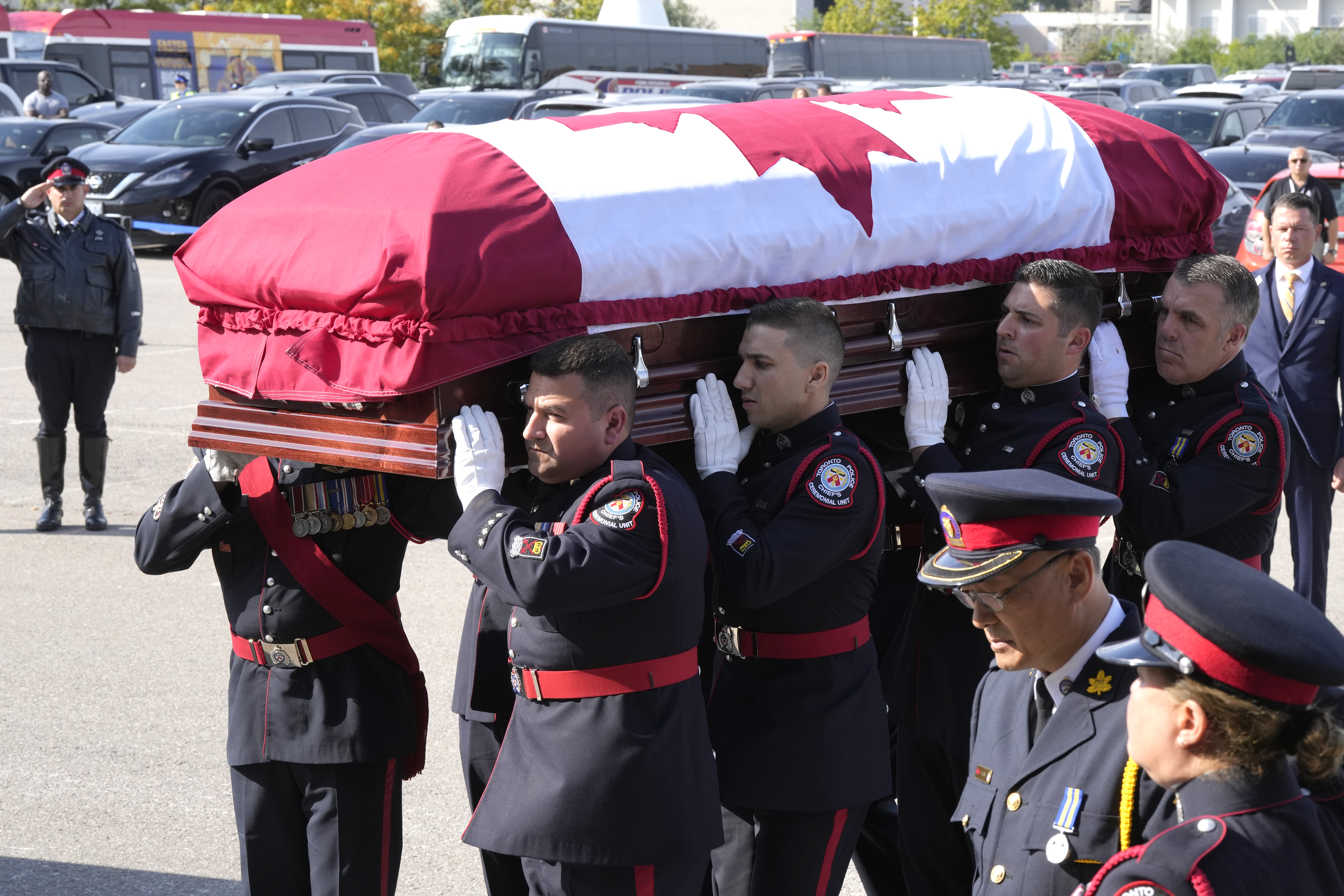 The casket of Const. Andrew Hong is carried into the Toronto Congress Centre during his funeral in Toronto on Wednesday, Sept. 21, 2022. Const. Hong was shot dead last week while on break during a training session in what police are calling an ambush attack. THE CANADIAN PRESS/Frank Gunn