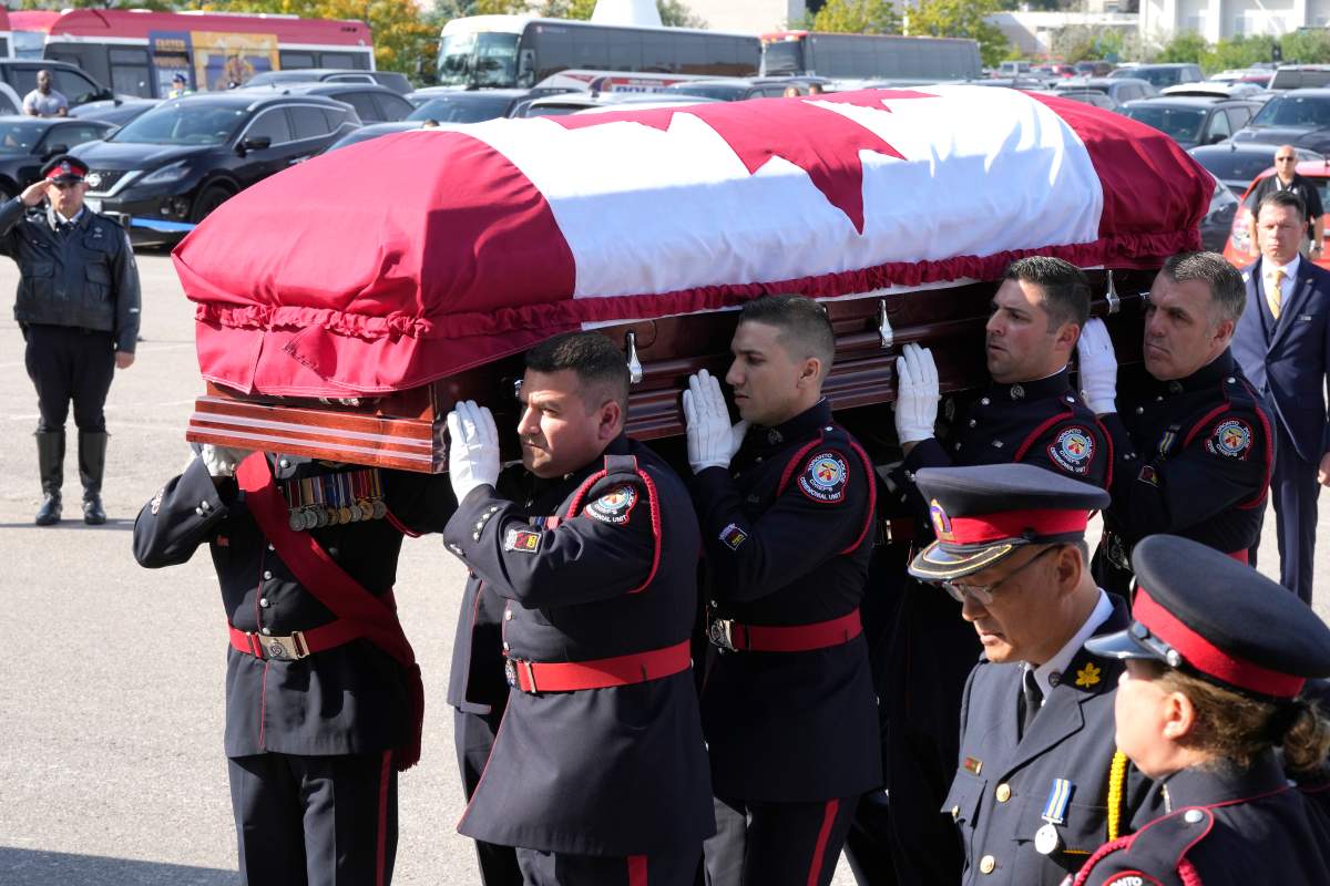 The casket of Const. Andrew Hong is carried into the Toronto Congress Centre during his funeral in Toronto on Wednesday, Sept. 21, 2022. Const. Hong was shot dead last week while on break during a training session in what police are calling an ambush attack. THE CANADIAN PRESS/Frank Gunn