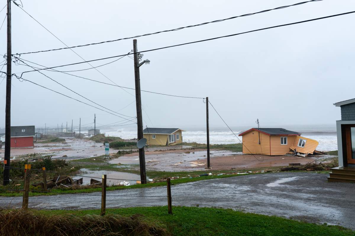 Damage to houses in la Martinique caused by post-tropical storm Fiona are shown on the Les Îles-de-la-Madeleine, Que., Saturday, Sept. 24, 2022. Coastal flooding remains a threat for parts of Nova Scotia, Prince Edward Island including the Northumberland Strait, the Gulf of St. Lawrence region including Iles-de-la-Madeleine and eastern New Brunswick, southwest Newfoundland, the St. Lawrence Estuary and the Quebec Lower North Shore. THE CANADIAN PRESS/Nigel Quinn