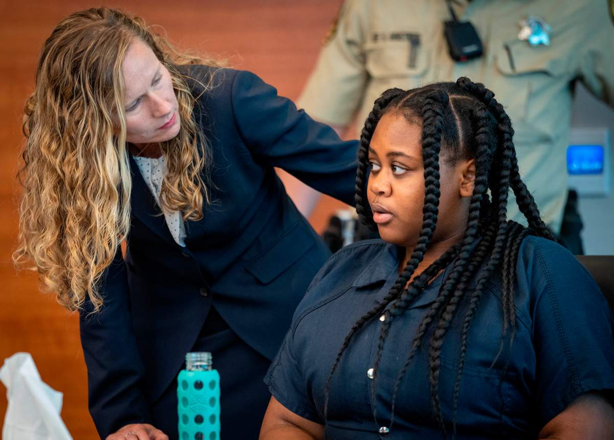 Pieper Lewis, right, speaks with attorney Magdalena Reese during a sentencing hearing Wednesday, Sept. 7, 2022, in Des Moines, Iowa. Lewis, who was initially charged with first-degree murder after she stabbed her accused rapist to death in June 2020, was sentenced Tuesday, Sept. 13, 2022, in an Iowa court to five years of closely supervised probation and ordered to pay $150,000 restitution to the man's family.