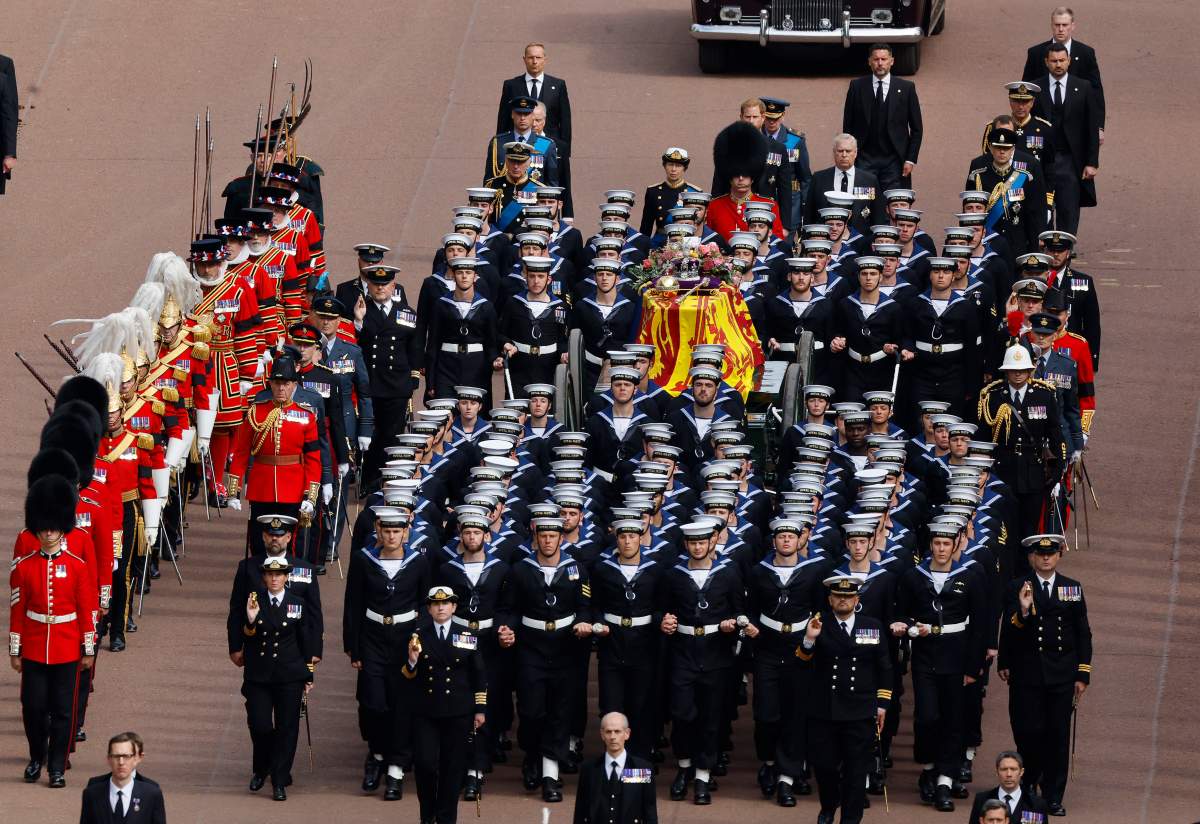 Queen Elizabeth II’s funeral cortege borne on the State Gun Carriage of the Royal Navy travels along The Mall in London, Monday, Sept. 19, 2022. (Chip Somodevilla/Pool Photo via AP)