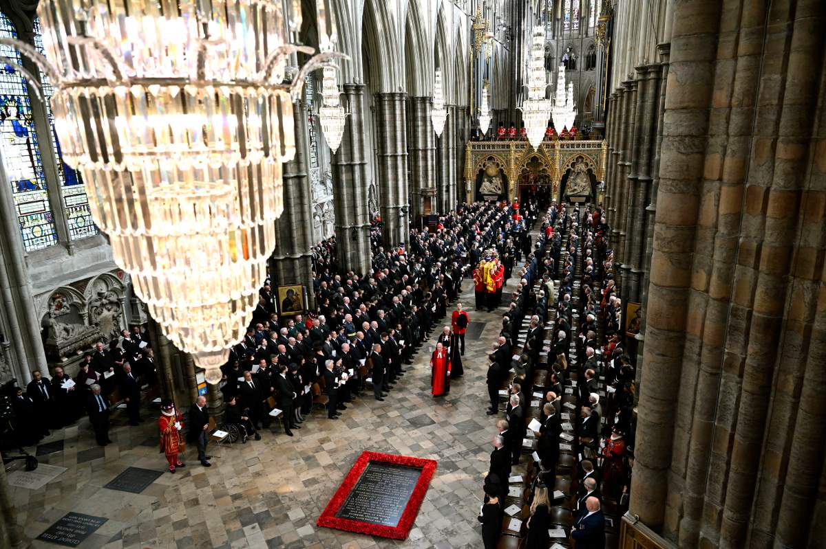 King Charles III, Camilla, the Queen Consort and other members of the Royal family follow behind the coffin of Queen Elizabeth II, draped in the Royal Standard with the Imperial State Crown and the Sovereign's orb and sceptre, as it is carried out of Westminster Abbey after her State Funeral, in London, Monday Sept. 19, 2022.