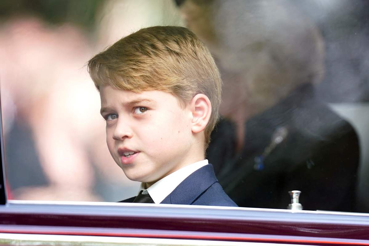 Prince George and Camilla, the Queen Consort, follow the State Gun Carriage carrying the coffin of Queen Elizabeth II, in the ceremonial procession following her state funeral at Westminster Abbey, London, Monday Sept. 19, 2022. (Mike Egerton/Pool Photo via AP)