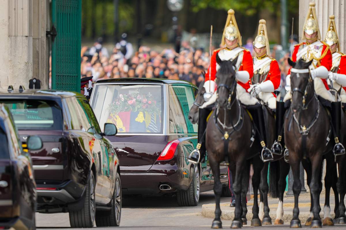 The coffin of Queen Elizabeth II is transported through London following her state funeral service in Westminster Abbey in central London Monday Sept. 19, 2022. (AP Photo/Martin Meissner, Pool)