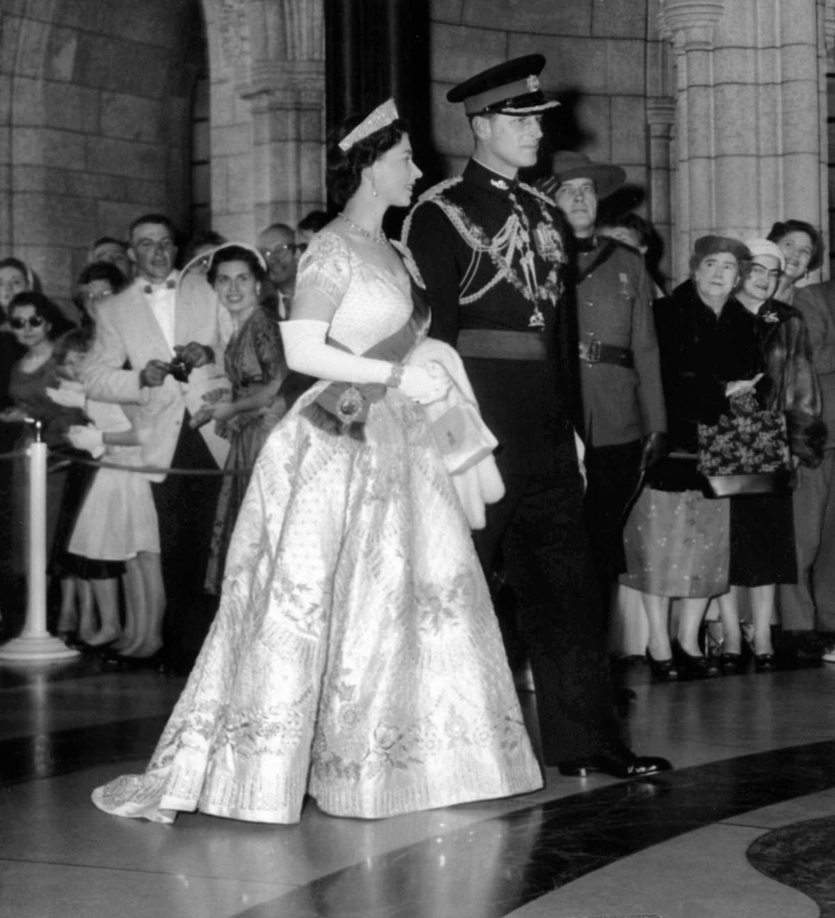 The Queen and Prince Philip enter the Senate to open Parliament Oct. 14, 1957. Prince Philip wears the uniform of a colonel-in-chief of the Royal Canadian Regiment, the Queen her Coronation gown.