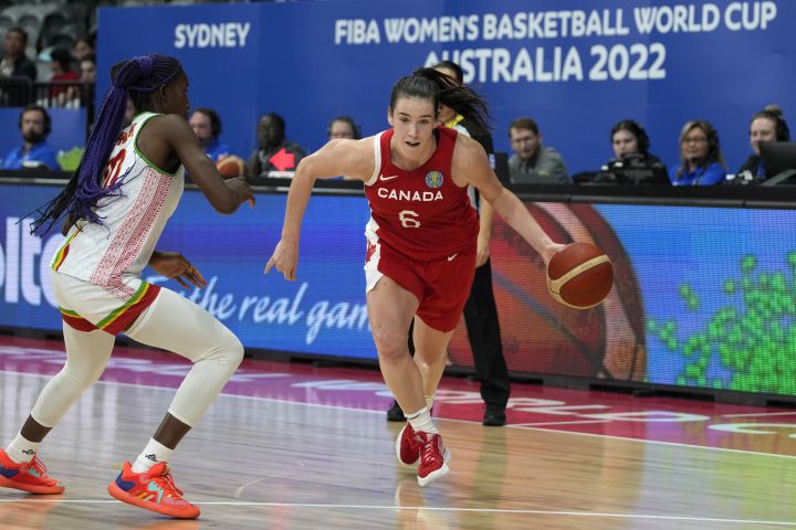 Canada's Bridget Carleton, right, goes past Mali's Maimouna Haidara during their game at the women's Basketball World Cup in Sydney, Australia, Tuesday, Sept. 27, 2022.