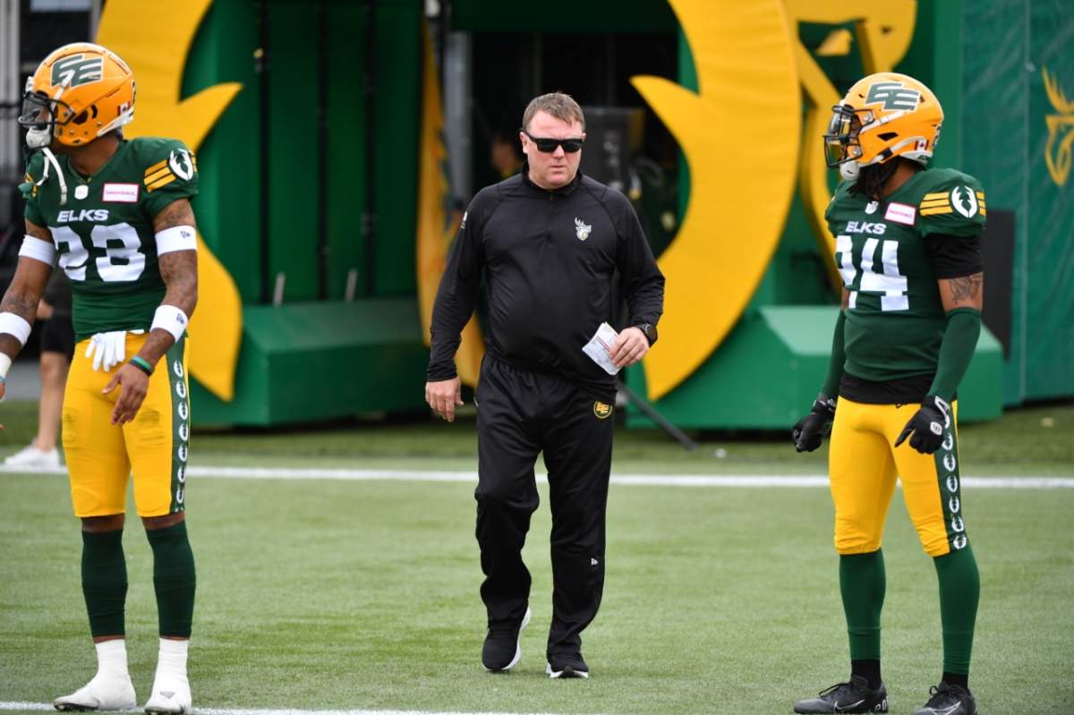 Elks head coach Chris Jones enters the field of play
