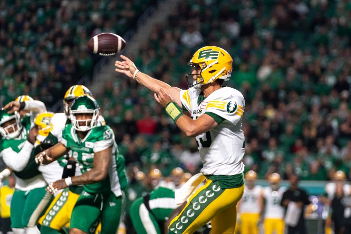Edmonton Elks quarterback Taylor Cornelius (15) throws against the Saskatchewan Roughriders during the first half of CFL football action at Mosaic Stadium in Regina, Sask., on Friday, September 16, 2022.