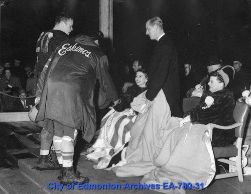 Princess Elizabeth and the Duke of Edinburgh at an Edmonton Eskimos game, where players Dick Huffman (Winnipeg Blue Bombers) and Frank Filchock (Edmonton Eskimos) were introduced to the royal couple during a visit to the city in 1951.