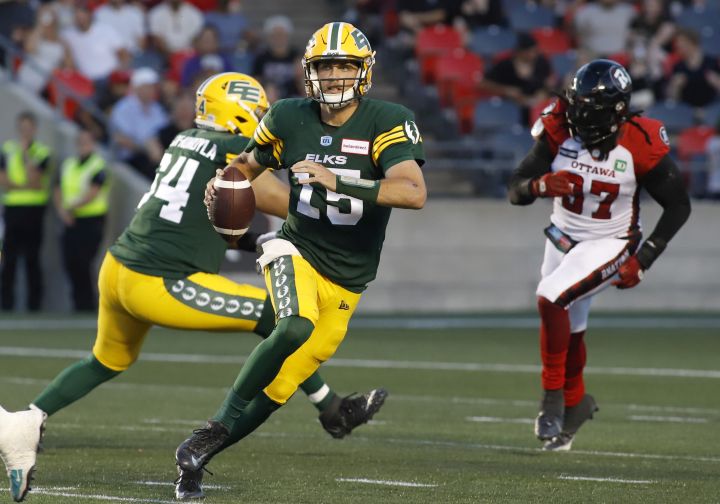 Edmonton Elks quarterback Taylor Cornelius (15) runs with the ball during first half CFL action against the Ottawa Redblacks in Ottawa on Friday, August 19, 2022.